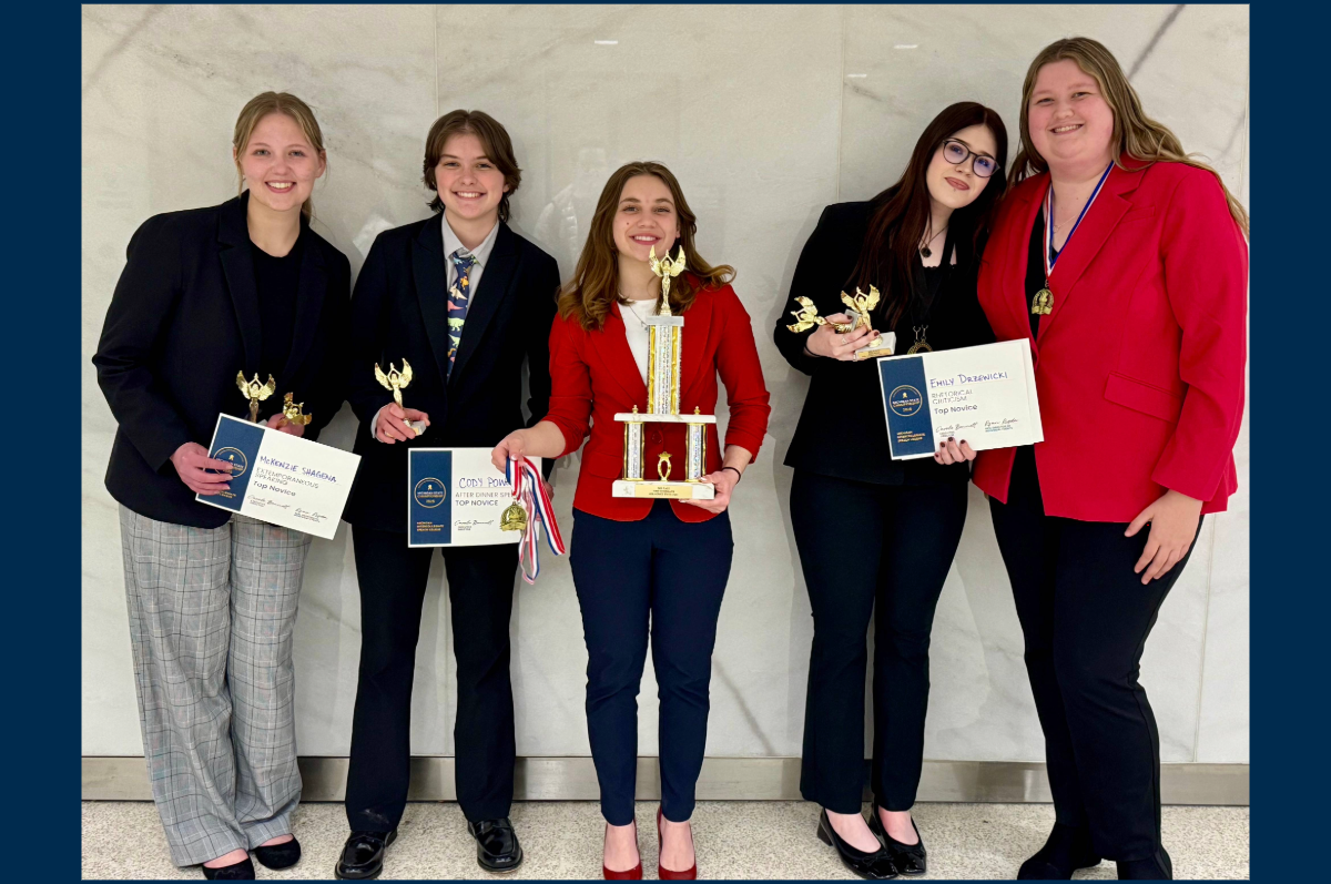 group of five students holding awards